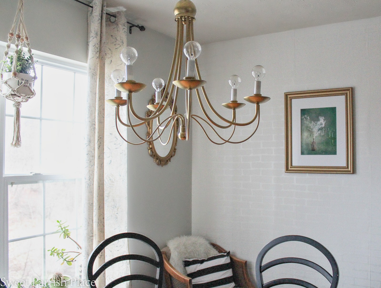 gold chandelier and wall art