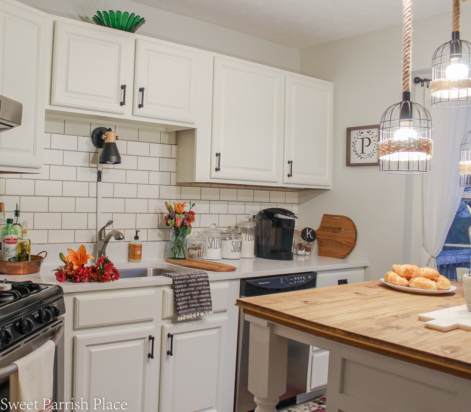 modern farmhouse kitchen with walls painted in gray owl by Benjamin Moore