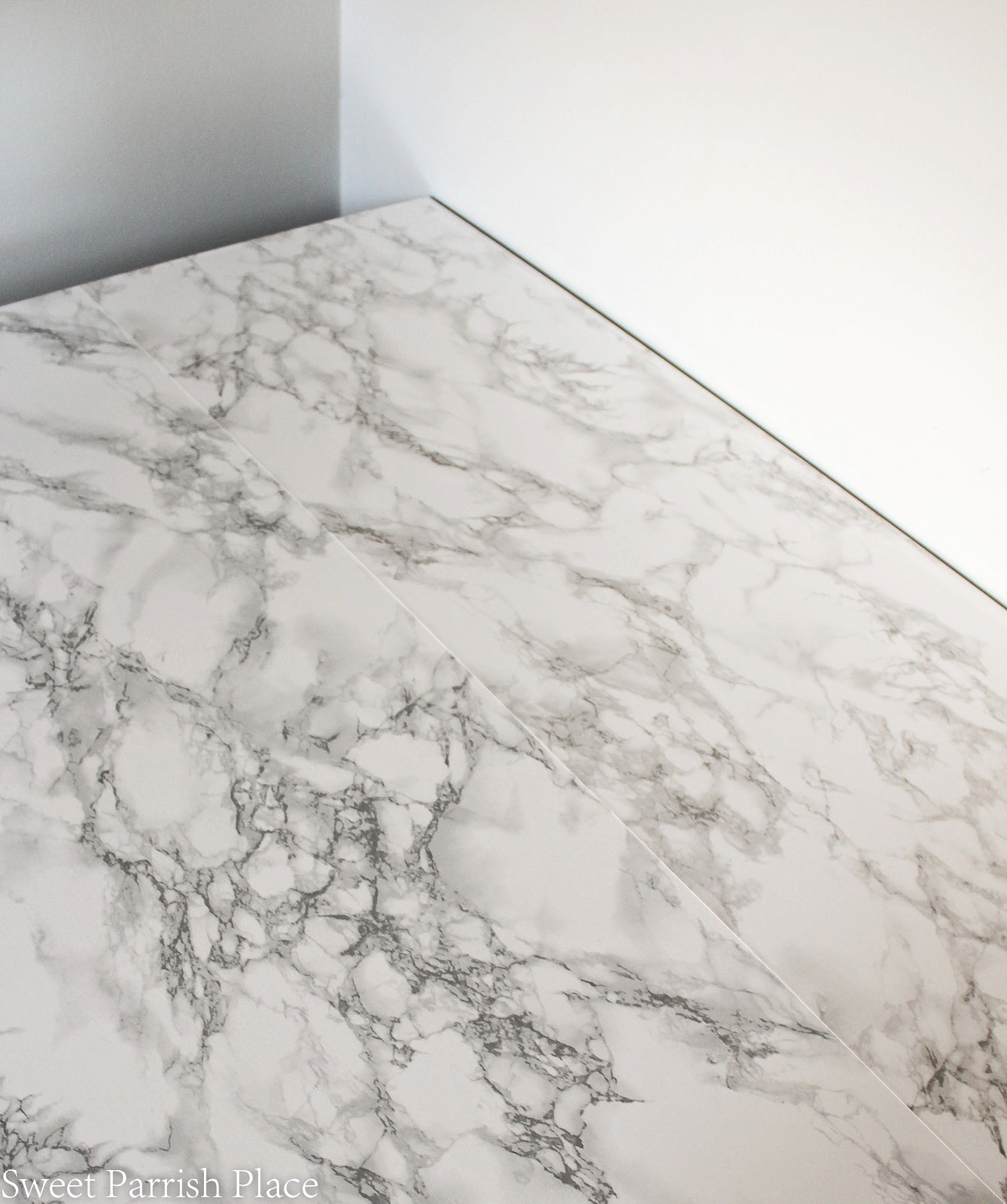 marble contact paper seam on desk top 