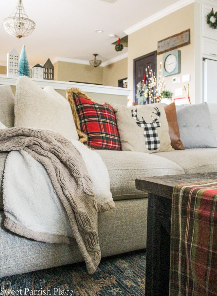 cozy throw on sofa with Christmas pillows